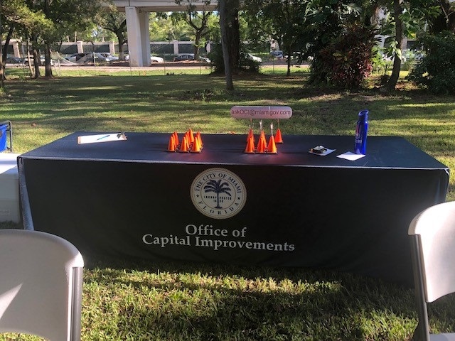 The Office of Capital Improvements Guest check-in table at the 3699/3701 New Mini Park Final Community Meeting