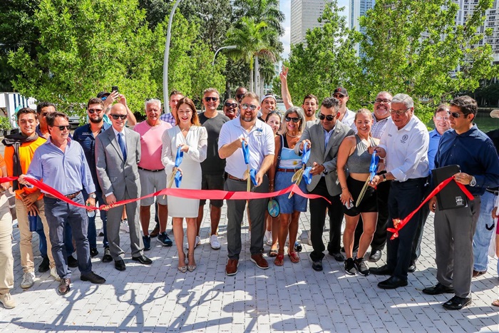 Commissioner Manolo Reyes and Commissioner SCommissioners, Contractor, designers and residents cutting the big red ribbon at the New Baywalk Ribbon Cutting Ceremony Behind First Presbyterian Church on Brickell