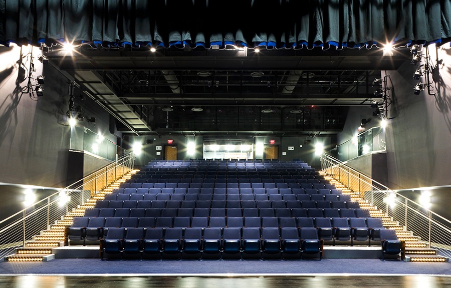Large auditorium with blue chairs